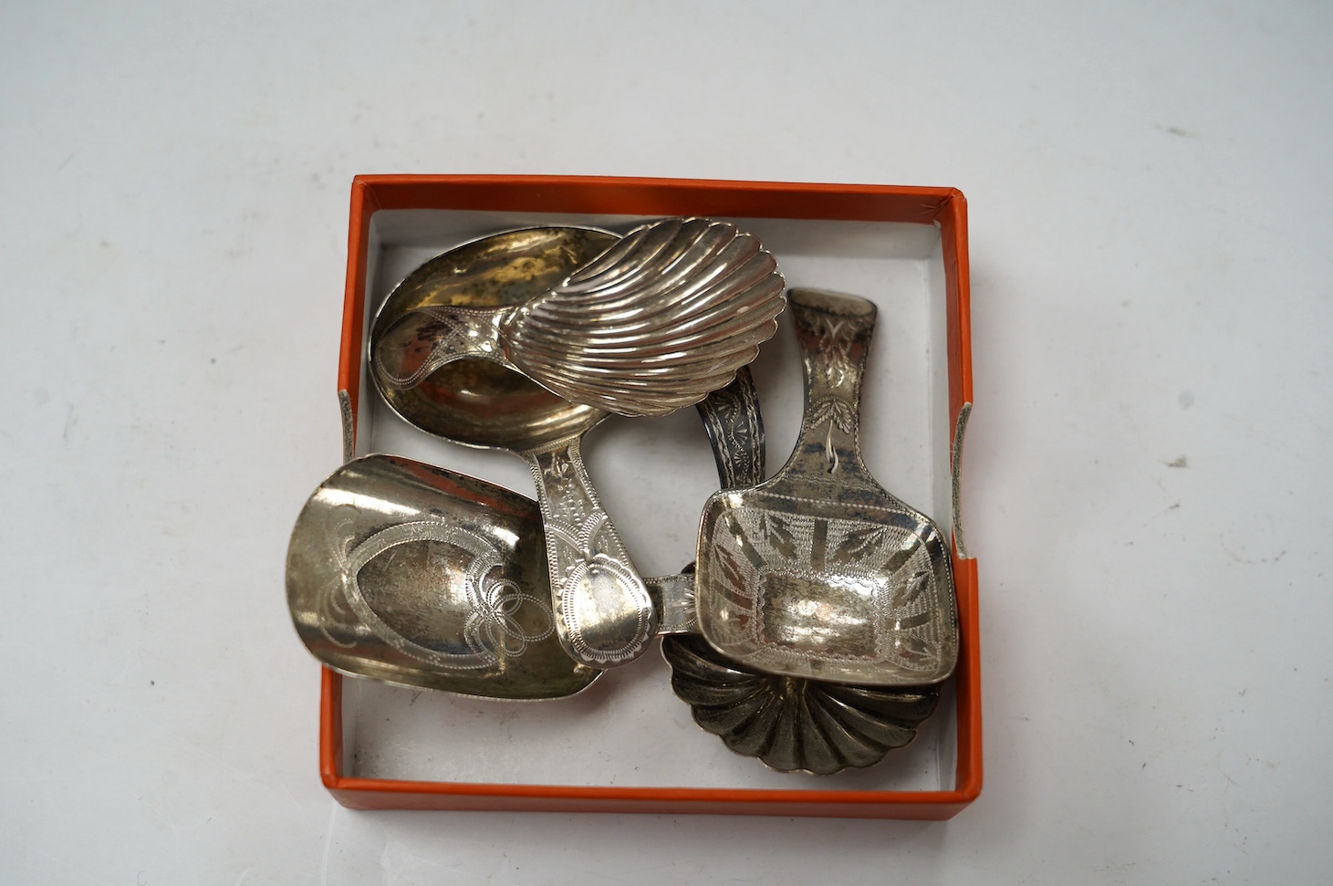 Five assorted silver caddy spoons, including shovel shape by Cocks & Bettridge, Birmingham, 1808, 71mm, oval bowl, John Blake, London, 1804, square bow, Joseph Wilmore, Birmingham, 1810, shell bowl, Joseph Taylor, Birmin